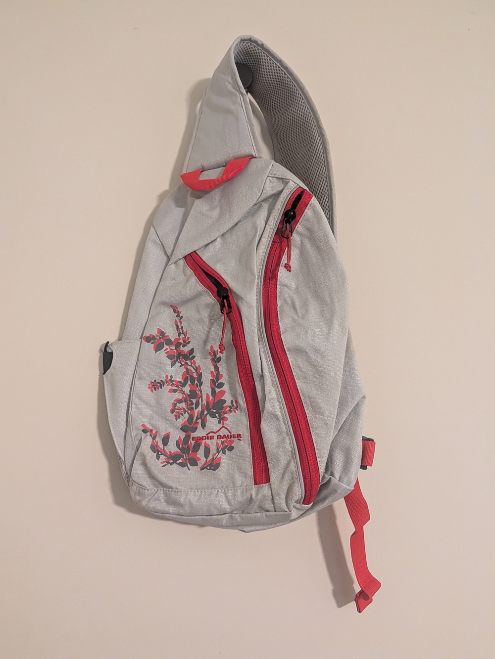 Gray and Red Eddie Bauer Sling Backpack with Floral Accent